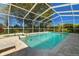 Relaxing screened-in pool with spa and patio furniture at 11114 Lake Sassa Dr, Thonotosassa, FL 33592