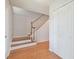 Elegant wooden staircase with a white railing leading to the upper level at 11114 Lake Sassa Dr, Thonotosassa, FL 33592