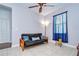 Common area with a daybed and window with blue curtains at 11302 Temperley Pl, Tampa, FL 33625