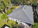 Single-story house with gray roof, and backyard at 116 S Hale Ave, Tampa, FL 33609