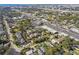 Wide aerial view showing the home's location near local businesses at 116 S Hale Ave, Tampa, FL 33609
