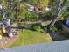 Large backyard with trees and wooden fence at 116 S Hale Ave, Tampa, FL 33609