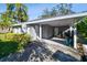 Single-car carport with gray exterior and storage at 116 S Hale Ave, Tampa, FL 33609