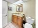 Clean bathroom with granite vanity and toilet at 1515 Pinellas Bayway S # 40, St Petersburg, FL 33715