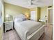 Bedroom with white queen bed and nightstands at 1515 Pinellas Bayway S # 40, St Petersburg, FL 33715