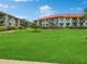 Expansive green lawn with condo buildings and lush landscaping at 1515 Pinellas Bayway S # 40, St Petersburg, FL 33715