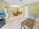 Bright dining area with table and chairs, view to living room at 1515 Pinellas Bayway S # 40, St Petersburg, FL 33715