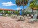 Community patio with tables and chairs at 1515 Pinellas Bayway S # 40, St Petersburg, FL 33715