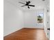 Bright bedroom with hardwood floors and ceiling fan at 1903 E New Orleans Ave, Tampa, FL 33610