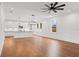 Spacious living room with hardwood floors, high ceilings, and ceiling fan at 1903 E New Orleans Ave, Tampa, FL 33610