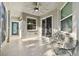 Spacious screened porch with ceiling fan and seating at 19156 Meadow Pine Dr, Tampa, FL 33647