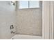 Updated bathroom with shower and tile surround at 19156 Meadow Pine Dr, Tampa, FL 33647