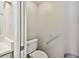 Small bathroom with toilet and grab bar at 19156 Meadow Pine Dr, Tampa, FL 33647