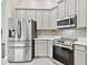 Modern kitchen with stainless steel appliances and a corner sink at 19156 Meadow Pine Dr, Tampa, FL 33647