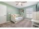 Small bedroom with a daybed and built in shelving at 19829 Morden Blush Dr, Lutz, FL 33558