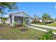 Light blue house with a screened porch, landscaped yard, and a two-car garage at 2420 28Th N St, St Petersburg, FL 33713