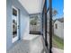 Screened porch features tiled flooring and backyard access at 2420 28Th N St, St Petersburg, FL 33713