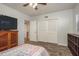 Bedroom with wood floors, large closet, and TV at 2451 Canadian Way # 47, Clearwater, FL 33763