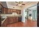 Modern kitchen features wood cabinets, granite counters, and breakfast bar at 2451 Canadian Way # 47, Clearwater, FL 33763