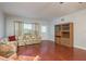 Spacious living room with wood floors and large window at 2451 Canadian Way # 47, Clearwater, FL 33763