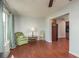 Comfortable living room with wood floors and ample natural light at 2451 Canadian Way # 47, Clearwater, FL 33763