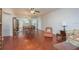 Open living room features a mirrored wall and wood floors at 2451 Canadian Way # 47, Clearwater, FL 33763