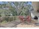 Outdoor deck with patio furniture and treetop views at 323 Ridge Rd, Palm Harbor, FL 34683