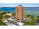 Aerial view of a high-rise building with parking and pool, overlooking the bay at 4015 Bayshore Blvd # 16A, Tampa, FL 33611