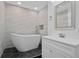 Spa-like bathroom with freestanding tub and wave tile at 4015 Bayshore Blvd # 16A, Tampa, FL 33611