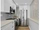 Modern kitchen with stainless steel appliances and white shaker cabinets at 4015 Bayshore Blvd # 16A, Tampa, FL 33611