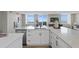 Modern kitchen with island, white cabinets, and water view at 4015 Bayshore Blvd # 16A, Tampa, FL 33611
