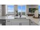 Kitchen with water view, stainless steel appliances, and white cabinets at 4015 Bayshore Blvd # 16A, Tampa, FL 33611