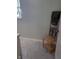 Bathroom with tiled floors, wooden towel rack, window and light gray walls at 4500 37Th S St # 27, St Petersburg, FL 33711