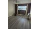 Bright bedroom with hardwood floors, neutral paint, ceiling fan, and natural light at 4500 37Th S St # 27, St Petersburg, FL 33711