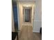A clean entryway showcasing tile and wood floors and featuring a security screen door at 4500 37Th S St # 27, St Petersburg, FL 33711