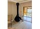 A decorative, retro fireplace with hearth, and sliding doors to the lanai at 4500 37Th S St # 27, St Petersburg, FL 33711