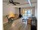 This beautiful living room features a unique fireplace, ceiling fan and sliding glass doors at 4500 37Th S St # 27, St Petersburg, FL 33711