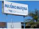 Sign for Maximo Marina an IGY destination on a partly cloudy day at 4500 37Th S St # 27, St Petersburg, FL 33711