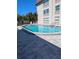 Community pool with surrounding patio at 4500 37Th S St # 27, St Petersburg, FL 33711