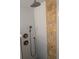 Shower with rain shower head, handheld sprayer, and decorative gold and tan accent wall at 4500 37Th S St # 27, St Petersburg, FL 33711