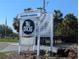 Maximo Marina sign with Tiki Docks brand on a sunny day at 4500 37Th S St # 27, St Petersburg, FL 33711