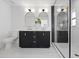 Elegant bathroom with double vanity, marble flooring, and a frameless glass shower at 475 Island Way, Clearwater Beach, FL 33767