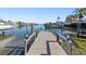 Private wooden dock extending over calm water at 475 Island Way, Clearwater Beach, FL 33767