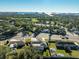 Aerial view of a home with a pool, near the water, and a neighborhood at 5909 Gulfport S Blvd, Gulfport, FL 33707