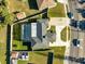 Aerial view of a home with a pool and a neighborhood at 5909 Gulfport S Blvd, Gulfport, FL 33707