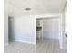 Bright living area with tile floors and access to kitchen at 6018 W Idlewild Ave, Tampa, FL 33634