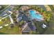 Aerial view showing clubhouse, pool, and playground at 6670 Paden Wheel St, Zephyrhills, FL 33541