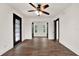 Bright bedroom with two windows and ceiling fan at 671 Jasmine S Way, St Petersburg, FL 33705