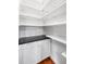 White pantry with dark countertop and adjustable shelving at 7416 S Morton St, Tampa, FL 33616