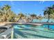 Inviting pool and spa surrounded by lush tropical landscaping, overlooking the water at 1 Marina Ter, Treasure Island, FL 33706